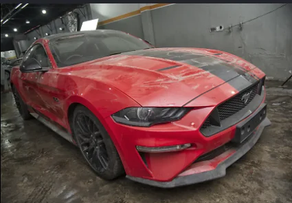Red Ford Mustang before exterior detailing